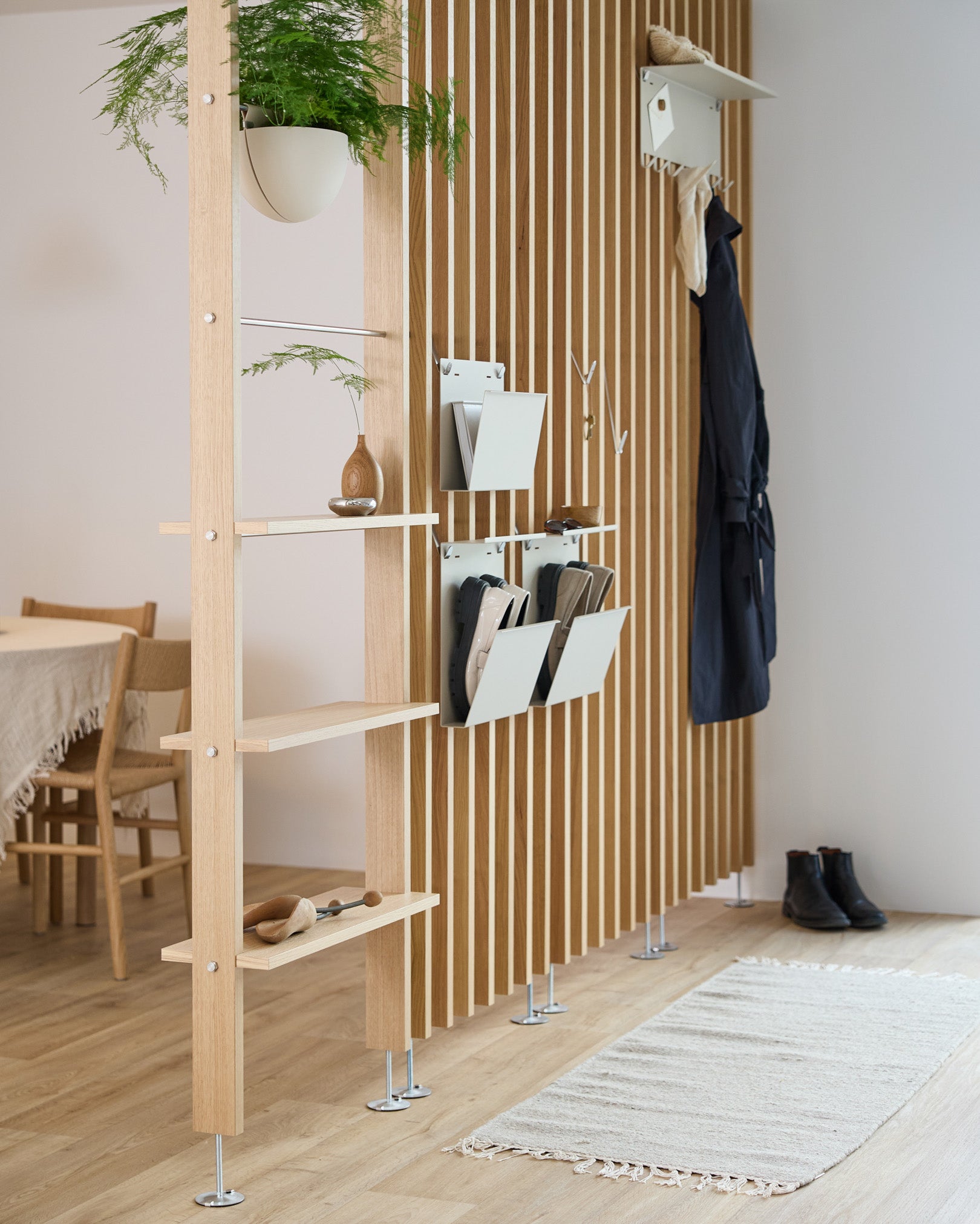 CREATE room divider with beige Nell shoe storage bins, metal shelves and coat hooks